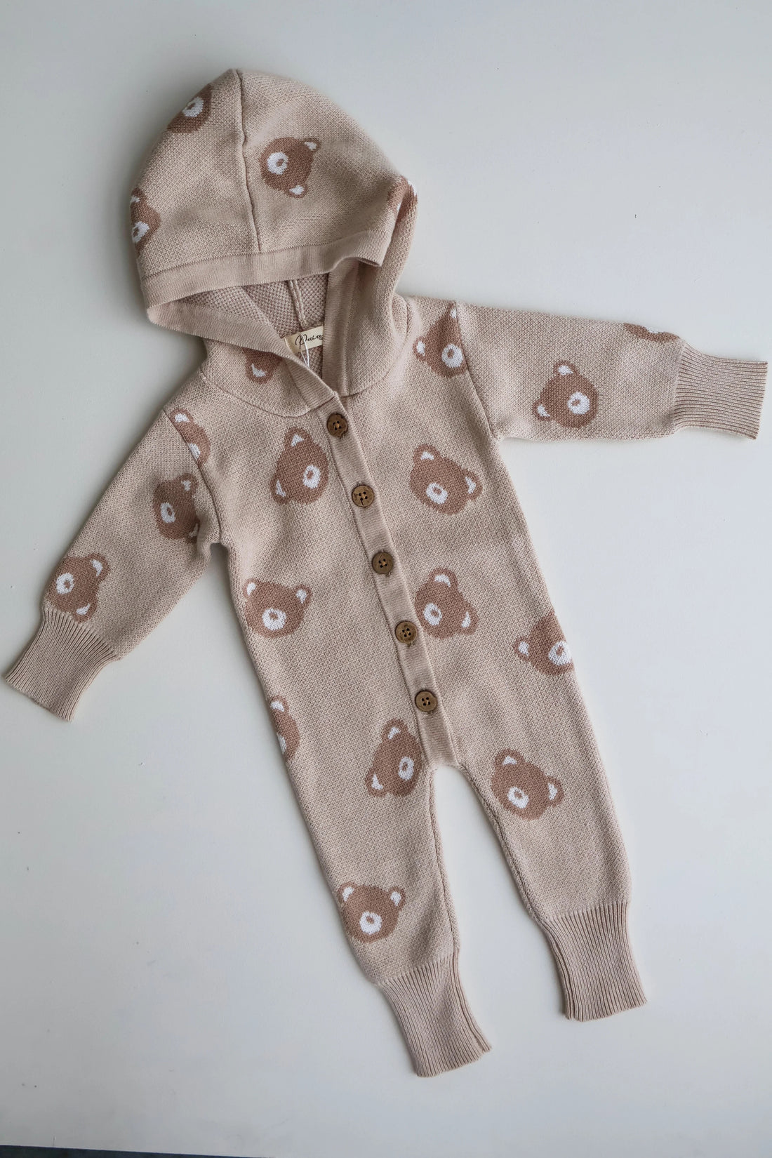 Petite + Co Hooded Teddy Romper vauvan neulehaalari hupulla